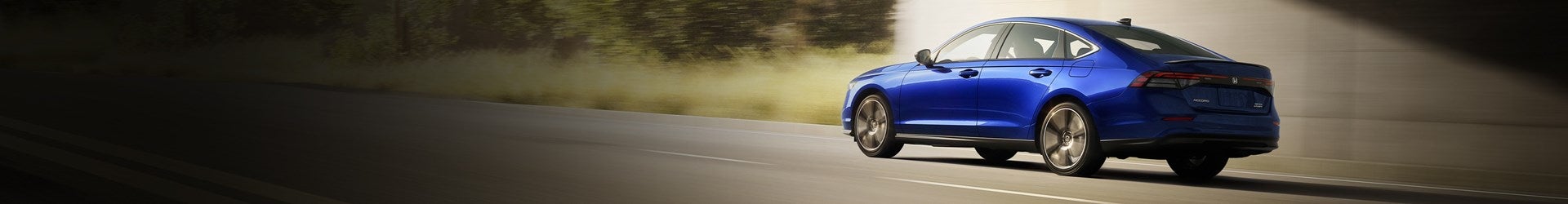 Back View of 2025 Honda Accord Hybrid on Highway