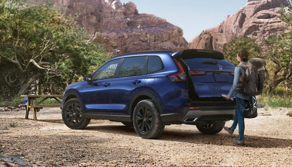 A person using the tailgate of the 2026 CR-V Hybrid SUV